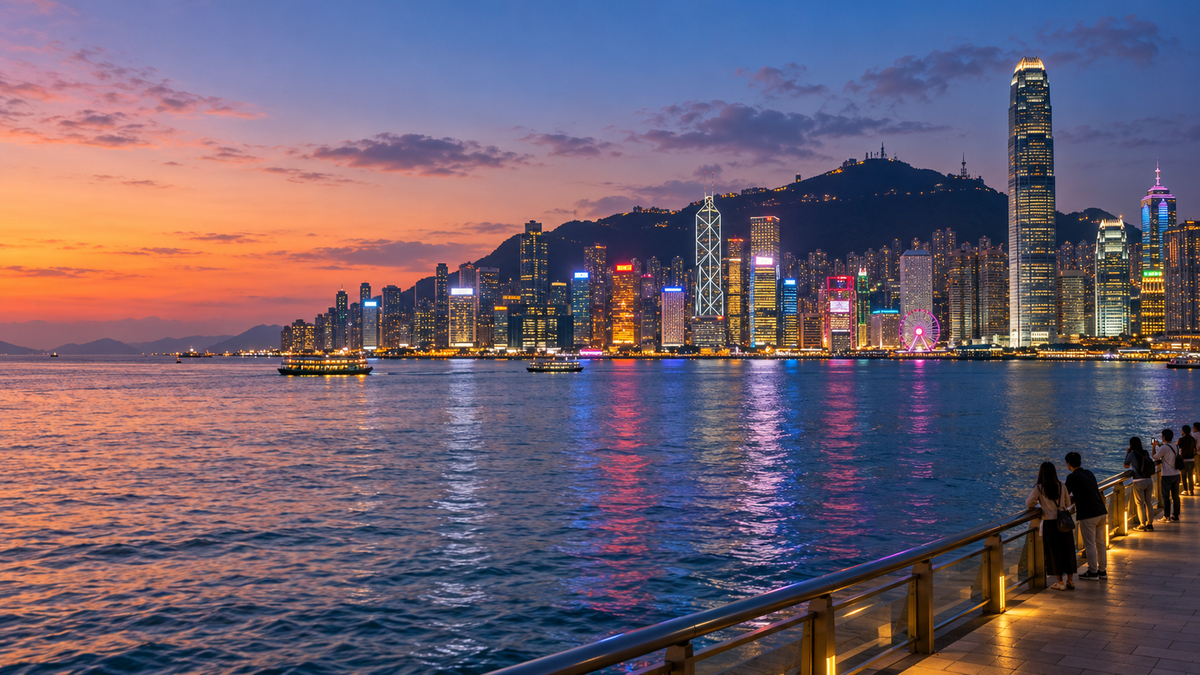 The Hong Kong Island skyline seen from the Tsim Sha Tsui promenade at dusk