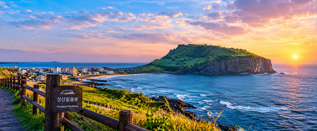 Seongsan Ilchulbong crater rising above the sea, Jeju Island